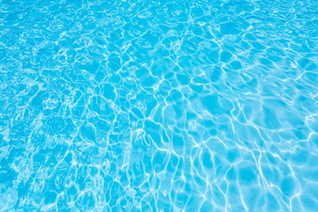 Fototapeta na wymiar Ripple water in swimming pool with sun reflection