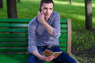 Fototapeta premium Young man using his phone