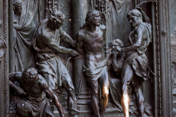 Detail of the Pieta scene in bas-relief at Milan's Cathedral doors,