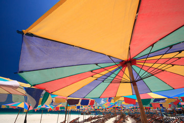 Beach chairs and parasol on Koh Khai island. Phuket, Thailand.