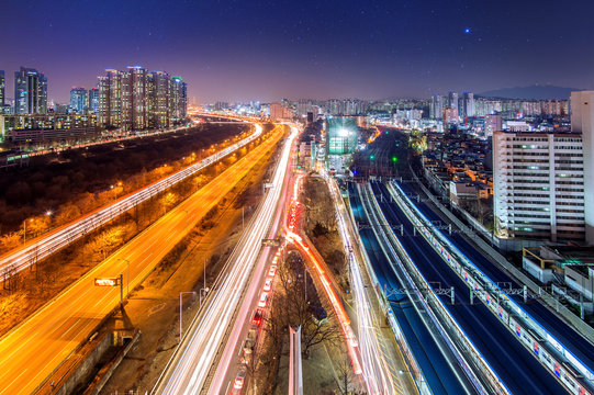 Traffic in Singil district, Seoul Korea skyline at night.