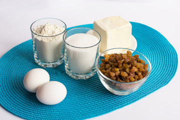 set of products for cooking muffins on the blue napkin