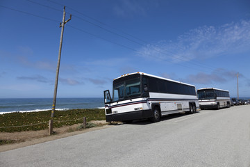 Fototapeta na wymiar Tour Buses Along Pacific Ocean