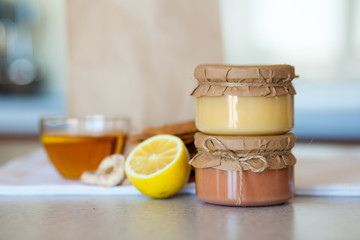 Sweet strawberry jam and lemon kurd on the table