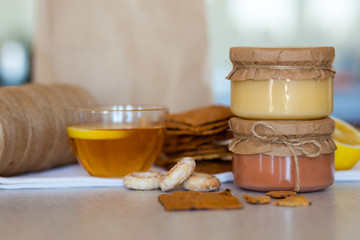 Sweet strawberry jam and lemon kurd on the table