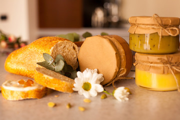 Sweet fruit jam in glass jars are on the table