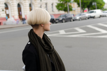 Fototapeta premium Young blonde woman walking in the city