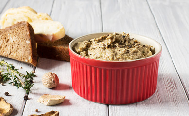 Mushroom pate on a white wooden background, horizontal, selective focus
