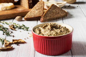 Mushroom pate on a white wooden background, horizontal, selective focus

