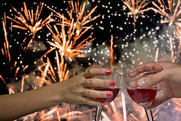 Hands holding glass of red wine