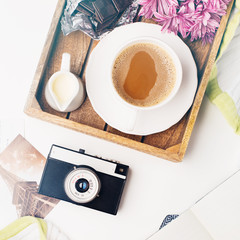 Cup of coffee, Bouquet of flowers, Vintage camera and chocolate, top view, toned