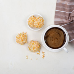Cup of coffee and homemade cookies on table. Breakfast time