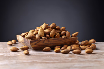 Almonds in old wooden dish