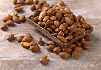 Almonds in old wooden dish