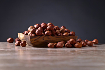 Hazelnuts in old wooden dish