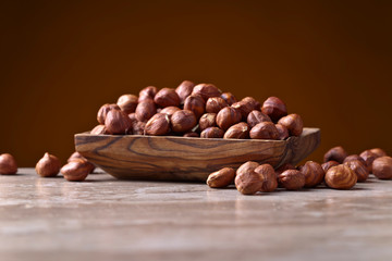 Hazelnuts in old wooden dish
