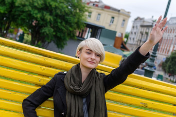 Young girl waving with her hand 