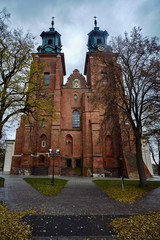 Towers of the gothic cathedral during autumn in Gniezno.