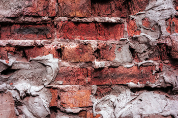 red  brick broken wall .