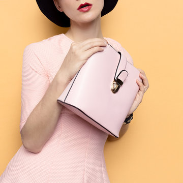 Model in a stylish retro hat and accessory bag. Love Retro Style