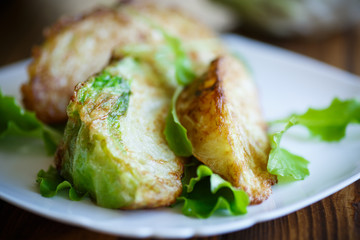 cabbage pieces fried in batter with salad