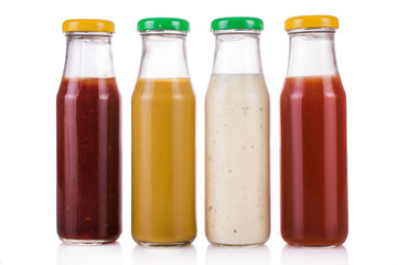 Bottled sauces. On white, isolated background.