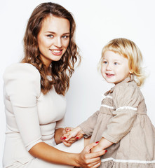 young pretty stylish mother with little cute daughter hugging, happy smiling family, lifestyle people concept
