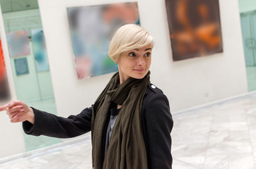 Young girl walking in the art gallery