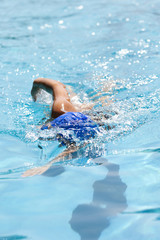  A young woman swimming in the pool