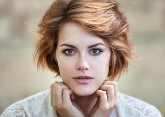 Beautiful young girl in white summer dress