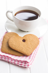 Gingerbread heart shape and coffee mug.