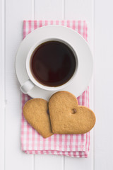 Gingerbread heart shape and coffee mug.