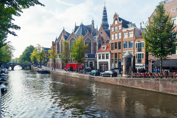 Fototapeta premium Traditional houses of Amsterdam with canals and bridges