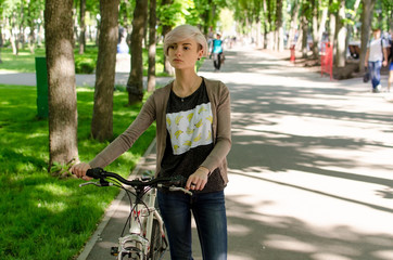 Young girl with a bicycle