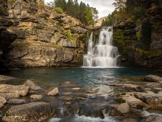 Waterfall flowing through the mountains