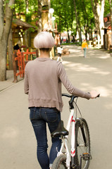 Young girl with a bicycle