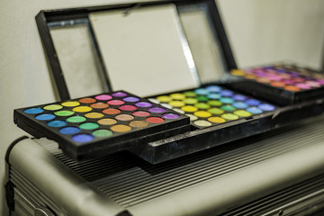 Makeup colorful eyeshadow and lip gloss palette box with mirror