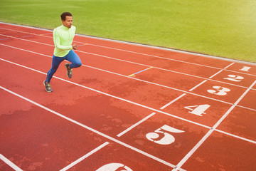 Running african man at stadium