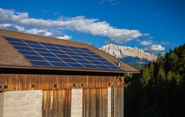 Big solar panel on the roof of house in the mountains of Italy