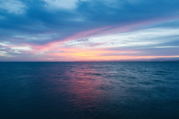 Sunrise over calm water