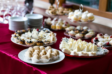 Candy Bar. Delicious sweet buffet with cupcakes. Sweet holiday buffet with cupcakes and other desserts.Table with sweets, candies, dessert