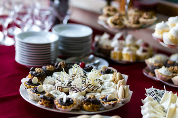 Candy Bar. Delicious sweet buffet with cupcakes. Sweet holiday buffet with cupcakes and other desserts.Table with sweets, candies, dessert