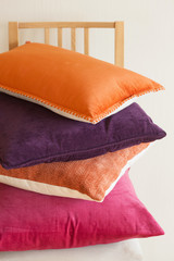 colorful cushions on chair cozy home mood