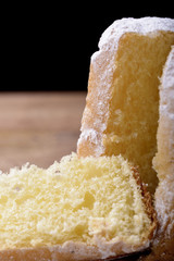 pandoro cake and slice with icing sugar
