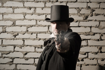 Fototapeta na wymiar Victorian style man with old gun
