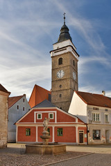 Fototapeta premium Renaissance church tower and old town houses in Slavonice, Czech Republic