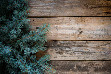 Christmas tree on wooden background, top view