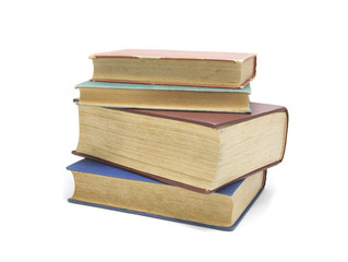 Stack of multi colored books isolated on white