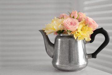 Bouquet of beautiful flowers in a pot on a  table
