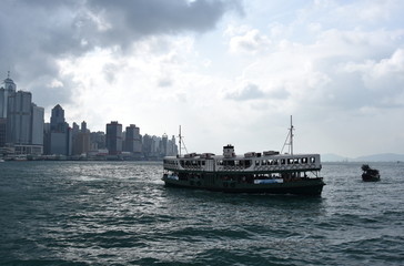 Hong Kong, Oct 29 2016. Star ferry at Victoria Harbor in Hong Kong. Skyline at Victoria Harbor, Hong Kong. View from Kowloon on Hong Kong Island.